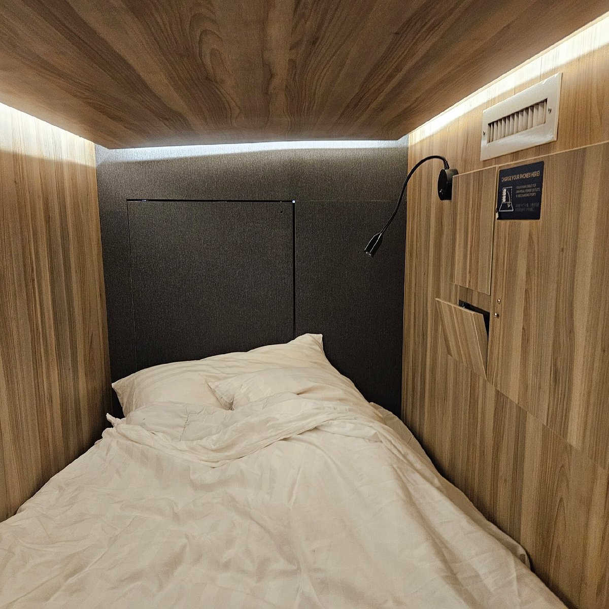 Sleeping cubes running down a narrow shophouse floor at MyCUBE by Temple Street in Singapore