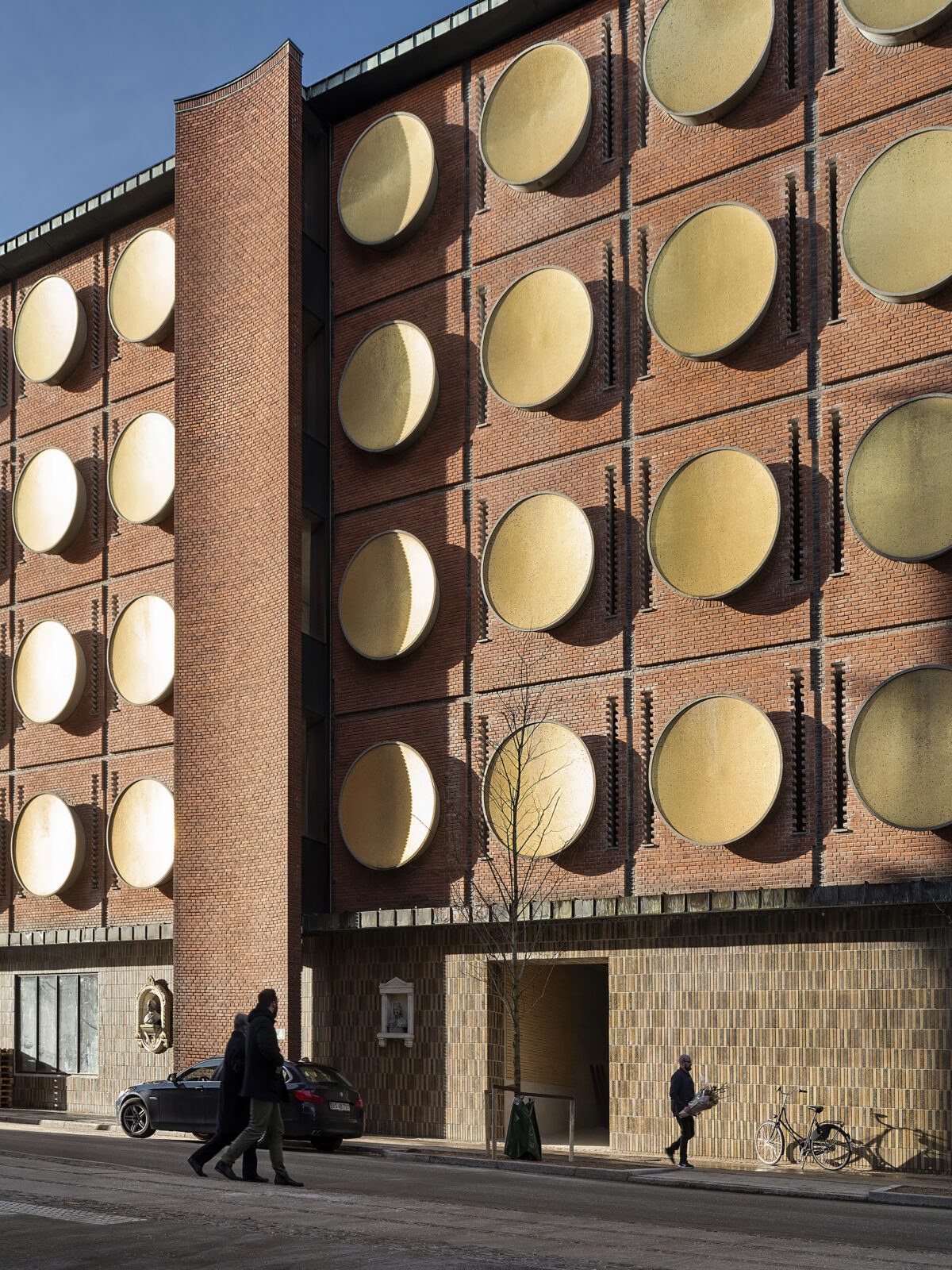 Brick wall and tall industrial opening in a former Carlsberg brewery building at Hotel Ottilia