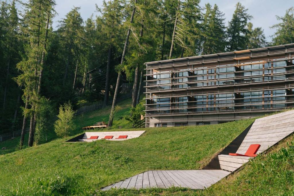 Larch-clad exterior of Vigilius Mountain Resort on the ridge above Lana in South Tyrol